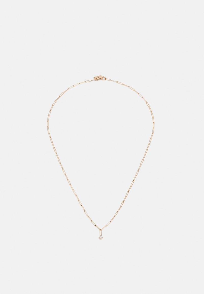 Auksinės spalvos kaklo grandinėlė, turinti pailgintus popieriaus segtukus ir mažą širdelės pakabuką su kristalo akcentu. Lygaus paviršiaus, lengvas dizainas.