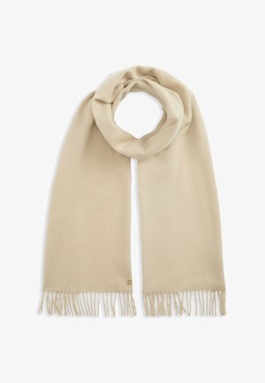 Écharpe beige douce avec des extrémités à franges, joliment bouclée en haut, présentée sur fond blanc.