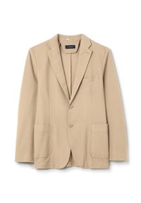 Blazer beige realizzato in tessuto testurizzato, con revers a zig zag, due tasche frontali e una tasca sul petto. Chiusura a due bottoni.