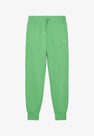 Pantalones de chándal verdes hechos de una tela suave, con cintura ajustable con cordón, bolsillos laterales y puños acanalados. Logo de Lacoste en la parte delantera.