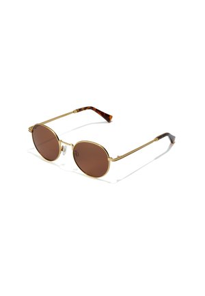 Gafas de sol redondas con lentes marrones, montura de metal dorado y puntas de las patillas con diseño de carey. Diseño elegante y almohadillas nasales ajustables.