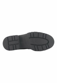 Suola in gomma nera con un pattern testurizzato, caratterizzata da scanalature profonde per una migliore aderenza e il nome del marchio "Nine West" impresso sulla superficie.