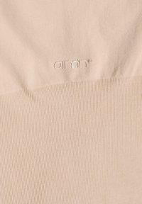 Beige ribbed fabric featuring a subtle sheen with a small, silver logo on the lower right. Soft texture with a smooth finish.