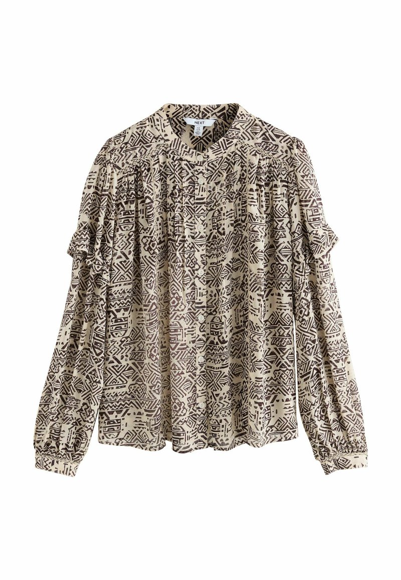 Blusa impresa en beige con patrones geométricos en marrón oscuro. Presenta detalles plisados y mangas abullonadas con puños elásticos. Material de mezcla de algodón.