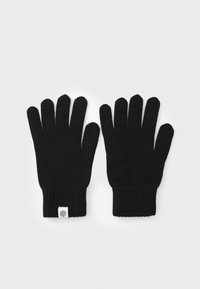 Mănuși tricotate negre cu mansete cu model în relief, având cinci degete și o etichetă mică cu logo pe mansetă. Textură moale și ajustare standard.