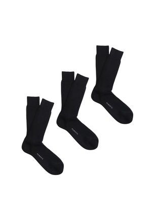 Tre paia di calzini neri a coste disposti uno accanto all'altro, ciascuno con la parola "PEROFIL" stampata vicino all'area delle dita.