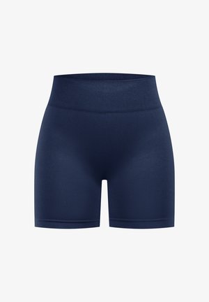 Marineblå sportsbukser med en bred, elastisk talje. Stoffet virker glat og strækbart, designet til komfort og bevægelsesfrihed.