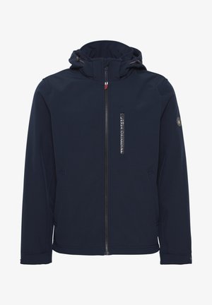 Sötétkék kapucnis dzseki puha shell anyagból, elöl cipzáros, oldalsó zsebekkel és logóval a sejemen. Sima felszín, könnyű kivitel.