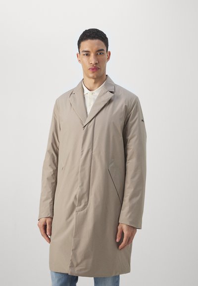 Light beige coat with a tailored design, long sleeves, and side pockets. Features a single-breasted front and smooth, matte texture.
