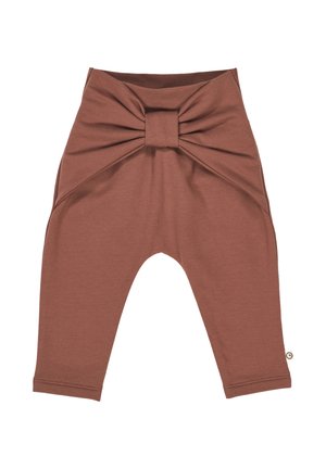 Braune Baumwoll-Leggings mit einem großen Knoten-Detail an der Taille, schmal zulaufenden Beinen und einer glatten Textur. Sie verfügen über seitliche Einsätze und dezente Nähte.