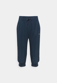 Navy blue cropped jogger-housut, joissa on elastinen vyötärö, nyörikiinnitys ja ribatut hihnat; sisältävät sivutaskut ja logopainatuksen.