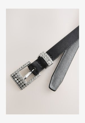 Mustast nahast vöö, millel on hõbedane pandla, mis on kaunistatud läbipaistvate litritega, halli tekstureeritud põhjaosaga ning elegantse ja kitsa disainiga.