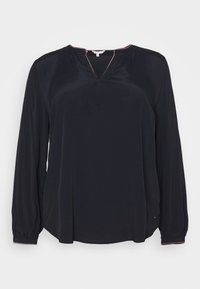 Zwarte blouse met lange mouwen in een gladde stof, voorzien van een V-hals met een kleine inkeping, en elastische manchetten met een contrasterende kleuraccent.