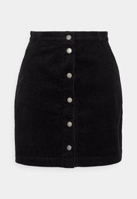 Mini falda de pana negra con cintura alta y botones metálicos a presión en el centro que bajan verticalmente.