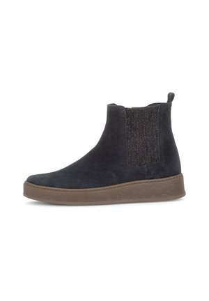 Black suede Chelsea ankle boot with elastic side panel and brown rubber sole, viewed from the outer side on a white background.