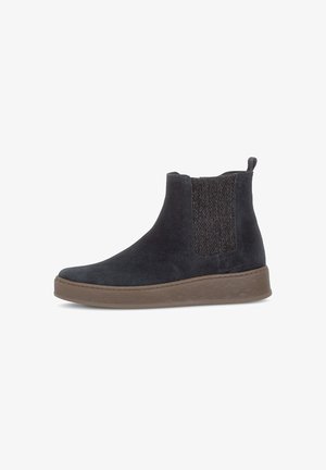 Black suede Chelsea ankle boot with elastic side panel and brown rubber sole, viewed from the outer side on a white background.