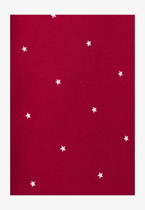 Tissu rouge au toucher lisse présentant de petits motifs d'étoiles blanches et jaunes éparpillés sur toute la surface.