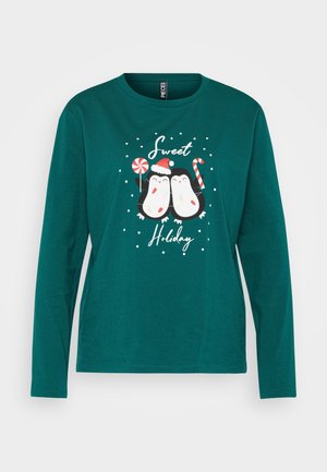T-shirt a maniche lunghe color turchese con due pinguini dei cartoni animati decorati per le festività, circondati da fiocchi di neve bianchi e la scritta "Dolci Festività".