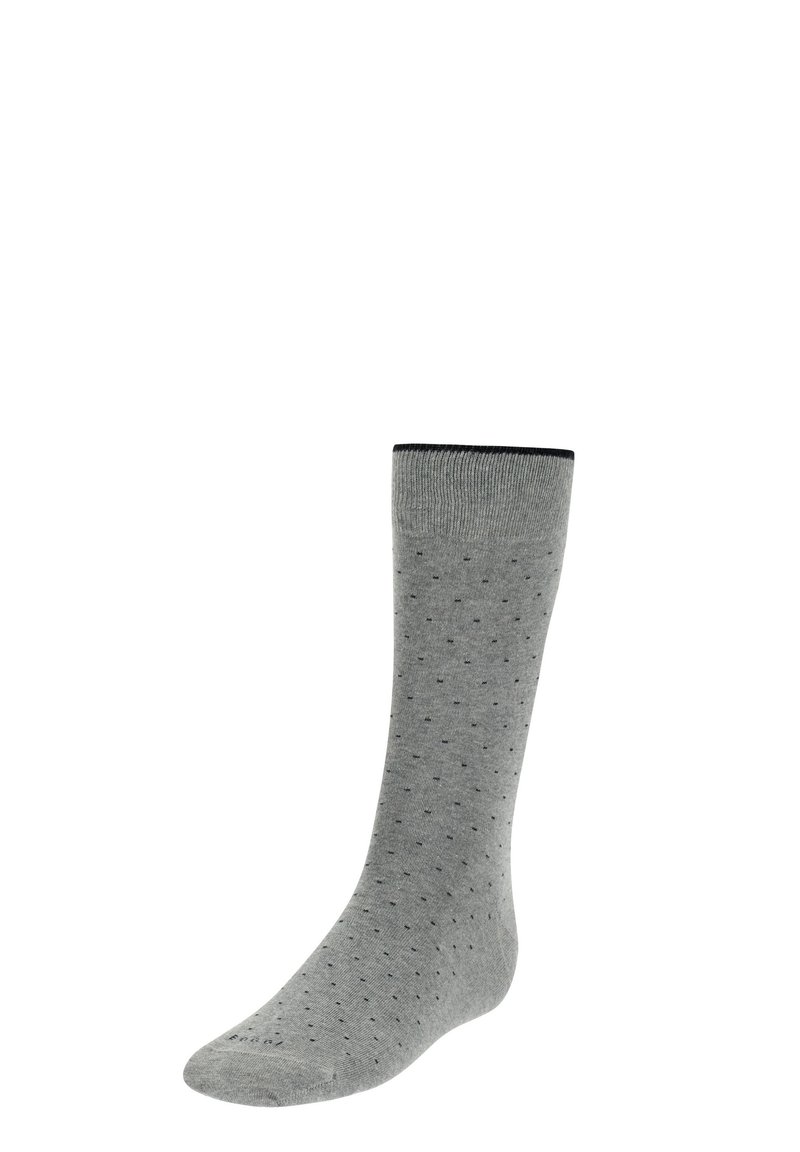 Calcetín de algodón gris con puño acanalado y pequeños puntos negros. El diseño presenta una textura suave y se extiende hasta la mitad de la pantorrilla.