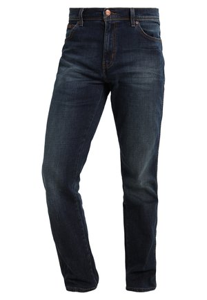 Dark blue denim jeans with a classic straight-leg fit, featuring a copper button fly, five pockets, and contrasting stitching details.