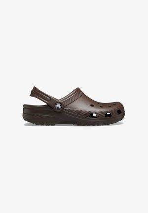 Brown slip-on clogs made of lightweight, textured synthetic material. Features ventilation holes, a reinforced heel strap, and a textured sole.