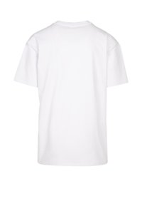 Hvid bomuld t-shirt, korte ærmer, rund hals og en afslappet pasform. Ensfarvet ryg uden mønstre eller detaljer. Glat tekstur.