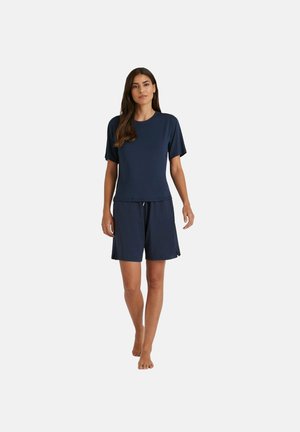 Haut à manches courtes bleu marine et shorts assortis en matériau doux, avec une coupe décontractée et une taille élastique à cordon.