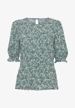 Blouse florale en bleu clair, avec un design froncé, des manches bouffantes et un détail en forme de clé au dos. Le matériau semble léger et texturé.