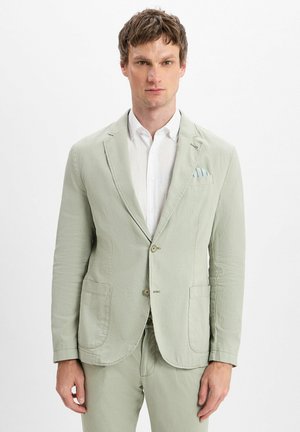 Light green, textured blazer with two front pockets, single button closure, and a subtle patterned pocket square on the left chest.