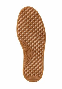 Semelle de chaussure en caoutchouc brun avec une texture en nid d'abeille, présentant un motif diagonal en relief et une impression de logo près du centre.