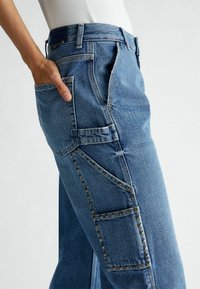 LIU JO WITH STUDS - Jeans a zampa - blue