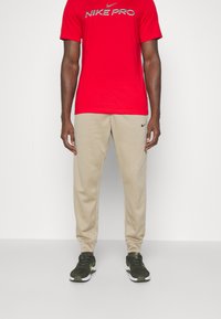 Nike Performance TAPER - Tréningruha alsók - khaki/khaki/(black)