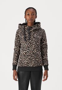Huppari leopardikuvioinnilla, mustalla vuorella, pitkät hihat ja ribbikantit sekä helma tiiviiseen istuvuuteen. Teksturoidusta kankaasta.