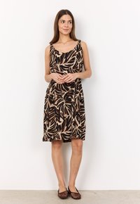 Ärmelloses Kleid mit tropischem Blättermuster in Erdtönen wie Schwarz, Braun und Beige. Weicher Stoff mit lockerer Passform, knielang.