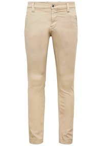 Chinos de algodón beiges con una textura suave, ajuste slim, bolsillos frontales tradicionales y un cierre de un solo botón en la cintura.