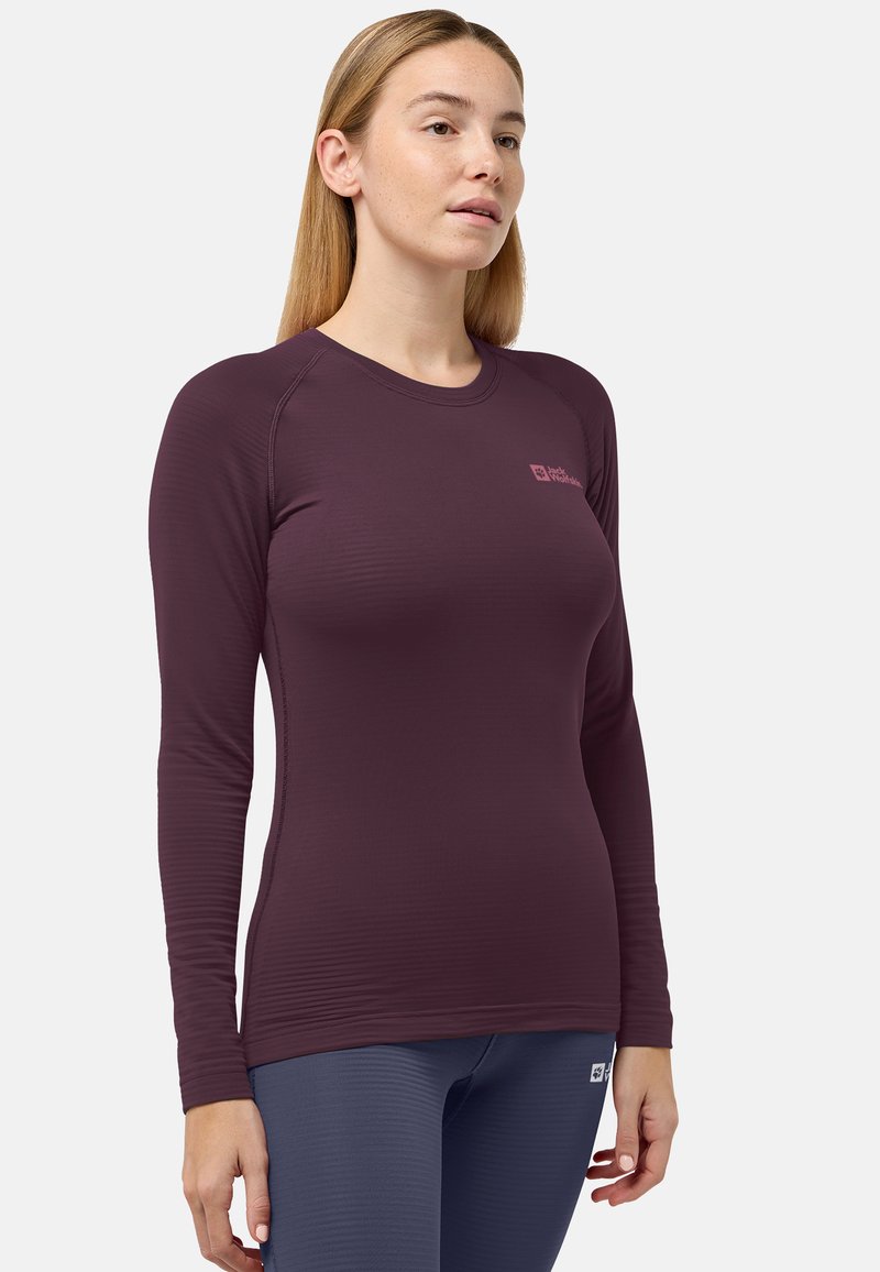 Camicia a maniche lunghe di colore borgogna realizzata in tessuto a coste, con scollo rotondo e un piccolo logo stampato sul lato sinistro del petto.