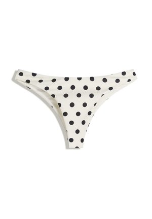 White bikini bottom with black polka dots, featuring a low-rise design and minimal coverage. Made of smooth, stretchy fabric for comfort.