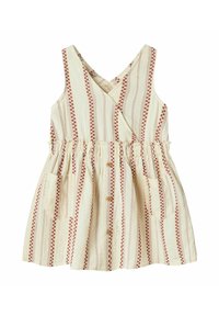 Ärmlöst beige klänningsplagg för småbarn med orange vertikala ränder, framknappar, draperad midja, korsad halsringning och två framfickor.