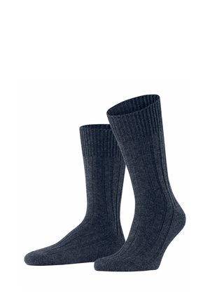 Baumwollsocken in Dunkelblau, mit einem gerippten Design und mittlerer Länge, die oben eng anliegen. Weicher Griff und nahtlose Verarbeitung.