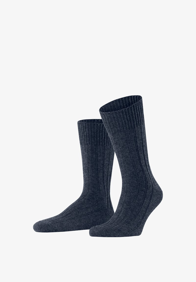 Baumwollsocken in Dunkelblau, mit einem gerippten Design und mittlerer Länge, die oben eng anliegen. Weicher Griff und nahtlose Verarbeitung.