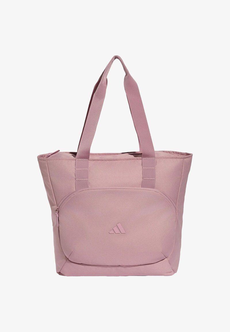Sac fourre-tout en tissu rose clair avec double sangle d'épaule et une poche avant zippée avec un petit logo triangulaire au centre.