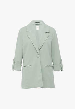 Jasnozielona marynarka wykonana z gładkiego materiału. Posiada wykładany kołnierz, dwie przednie kieszenie oraz podwinięte rękawy z ozdobnymi guzikami.