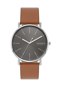 Montre Skagen ronde avec un cadran gris foncé, des index argentés et un bracelet en cuir marron. Design minimaliste, lignes épurées et finition polie.