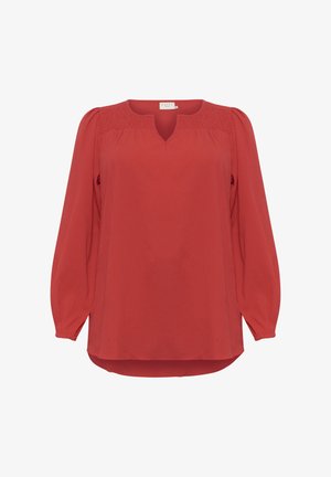 Blusa rossa con maniche lunghe a sbuffo, scollatura a V e dettagli arricciati sulle spalle. Realizzata in tessuto leggero e testurizzato con orlo curvo.
