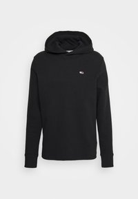 Sudadera con capucha negra, con textura acanalada, mangas largas y un pequeño logo en el pecho. Fabricada con una tela suave y duradera.
