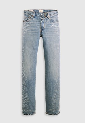 Lichtblauwe denim jeans met een recht gesneden pasvorm, voorzien van ingewikkelde bedelversieringen langs de zijkanten en een klassieke vijf-pocket ontwerp.