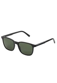 Ochelari de soare dreptunghiulari negri, cu lentile de un verde închis. Fabricate din plastic, având o finisare netedă și brațe subțiri, drepte. Marcaj de marcă vizibil pe braț.