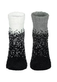 Flauschige Socken mit einem Farbverlauf von Weiß oben nach Schwarz unten, die eine weiche Textur und einen gemütlichen Sitz haben.