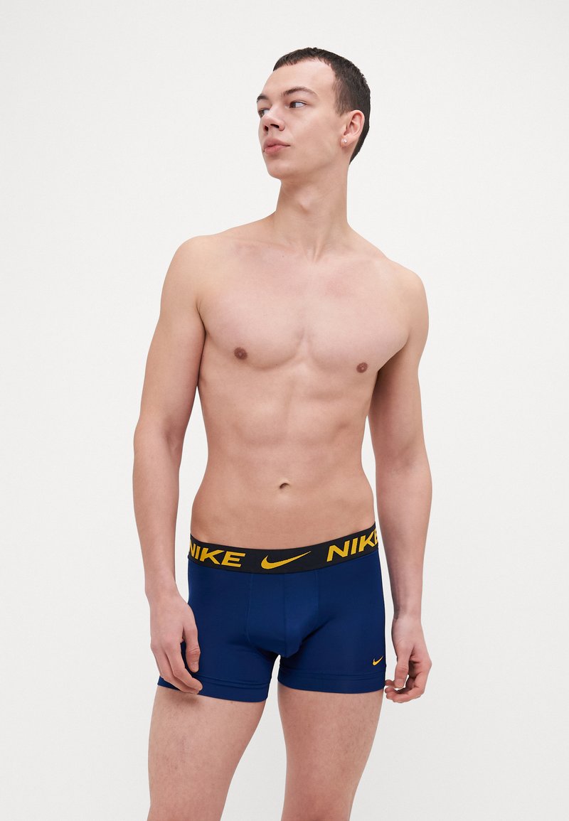 Nike Underwear TRUNK 3 PACK - Calzoncillos - uni gold/dark grey/blue void
