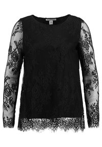 Top in pizzo nero con maniche lunghe trasparenti, motivi floreali, scollatura rotonda e orlo scallopato. Realizzato in materiale pizzo con una finitura testurizzata.